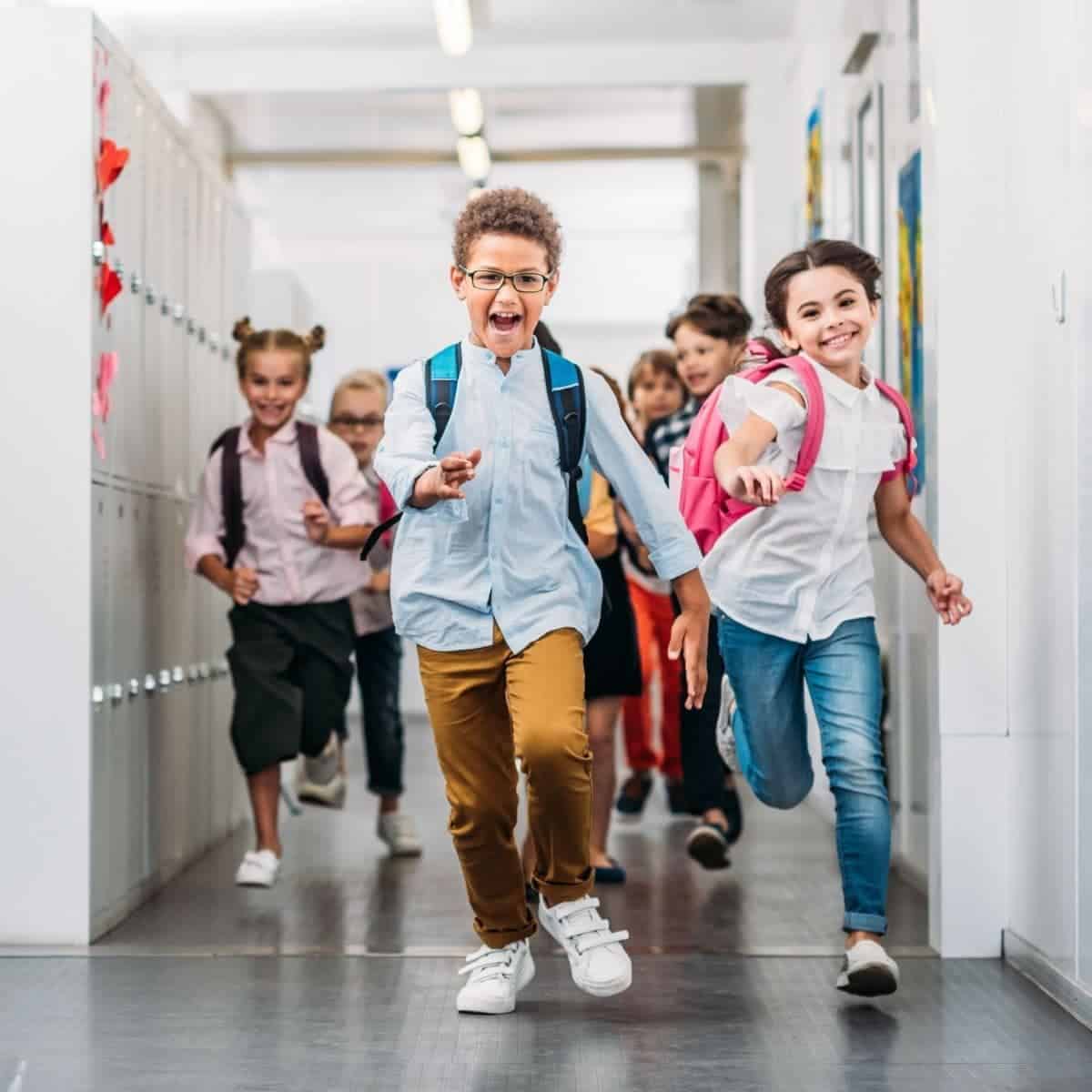 Kids running in a school hallway.